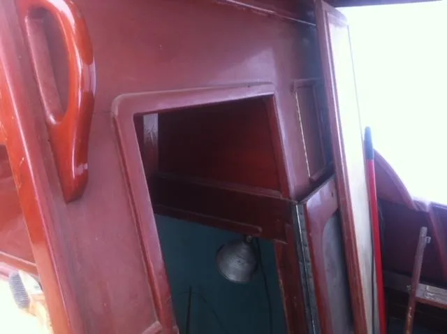 Slide: The Image of 1952 Chris-Craft Buccaneer interior with wooden paneling and vintage design elements. - 8
