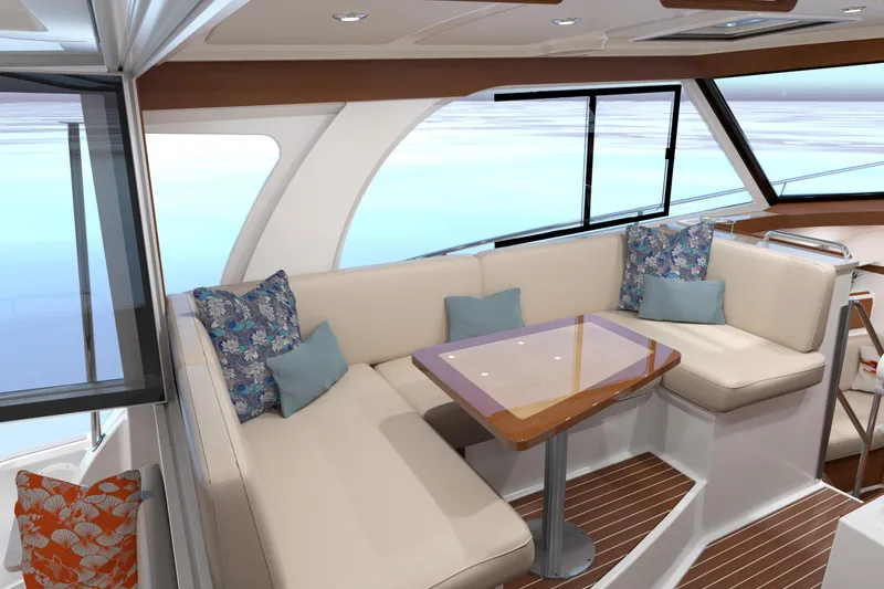 Slide: The Image of Luxurious interior of 2027 Back Cove 39O yacht with elegant seating and cushions. - 7