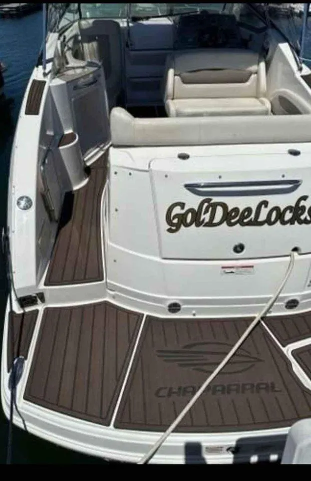 Slide: The Image of 2010 Chaparral 270 Signature boat with custom "GolDeeLocks" name on deck. - 17