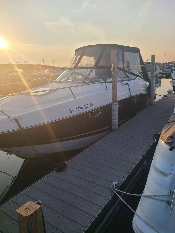 Slide: The Image of 2010 Chaparral 270 Signature boat docked at sunset. - 18