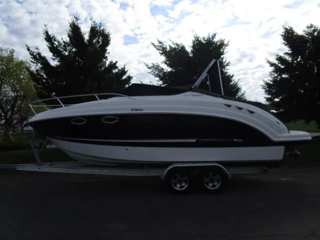 Slide: The Image of 2010 Chaparral 270 Signature boat on trailer, parked outdoors. - 4