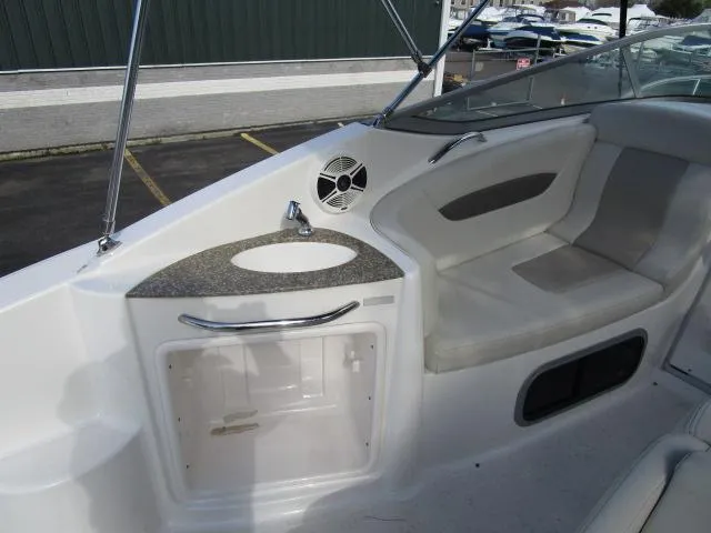 Slide: The Image of 2010 Chaparral 270 Signature boat interior with seating and sink area. - 7