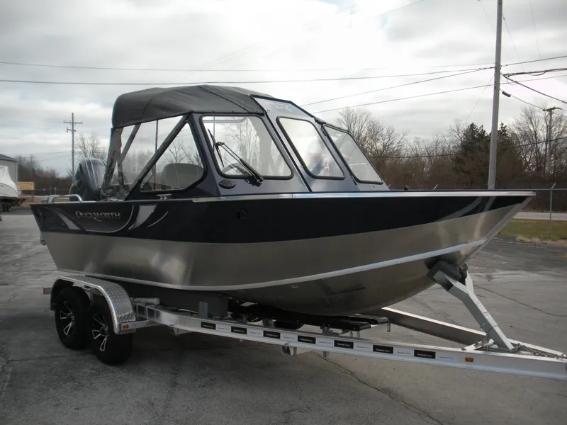 Slide: The Image of 2024 Duckworth 18 Advantage Sport boat on a trailer, parked outdoors. - 7