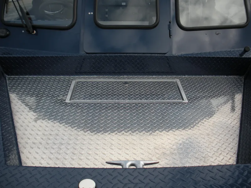 Slide: The Image of 2024 Duckworth 18 Advantage Sport boat deck with diamond plate flooring. - 8