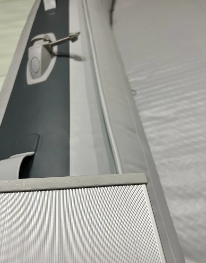 Slide: The Image of Close-up of a 2023 Gala F300A inflatable boat's interior and side. - 2