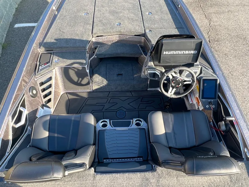 Slide: The Image of 2025 Skeeter FXR20 Limited boat interior with dual seats, steering wheel, and Humminbird display. - 10
