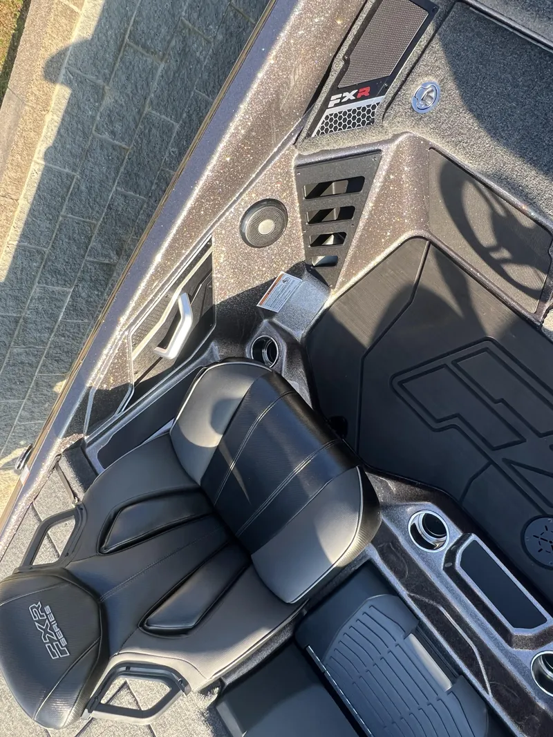 Slide: The Image of 2025 Skeeter FXR20 Limited boat interior with sleek black seating and modern design elements. - 4