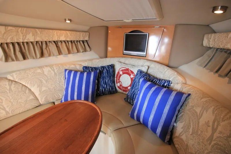 Slide: The Image of Interior of 2006 Chaparral 276 Signature Cruiser with cozy seating and nautical decor. - 21