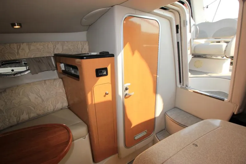 Slide: The Image of Interior of 2006 Chaparral 276 Signature Cruiser with seating and cabin door. - 24