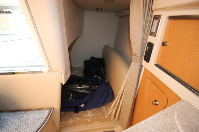 Slide: The Image of Interior cabin of 2006 Chaparral 276 Signature Cruiser with storage space. - 28