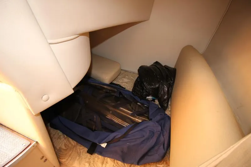Slide: The Image of Interior storage space of 2006 Chaparral 276 Signature Cruiser with bags. - 29