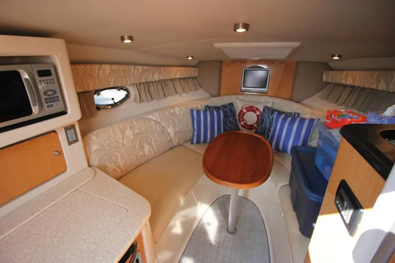 Slide: The Image of Interior of 2006 Chaparral 276 Signature Cruiser with cozy seating and modern amenities. - 20