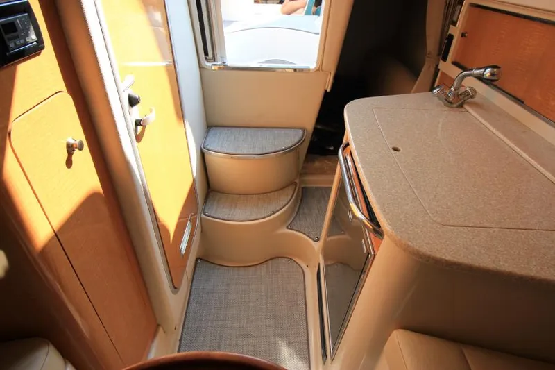 Slide: The Image of Interior of 2006 Chaparral 276 Signature Cruiser with steps and kitchenette. - 23