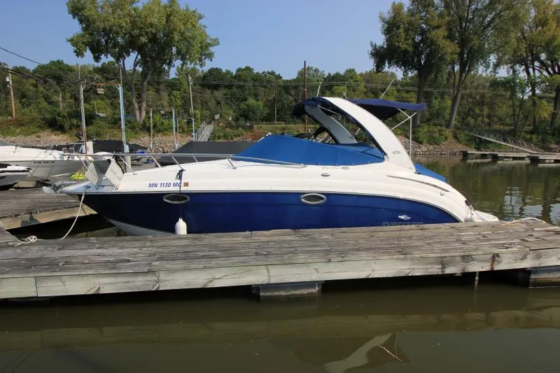 The Image of 2006 Chaparral 276 Signature Cruiser docked on calm water. - 3
