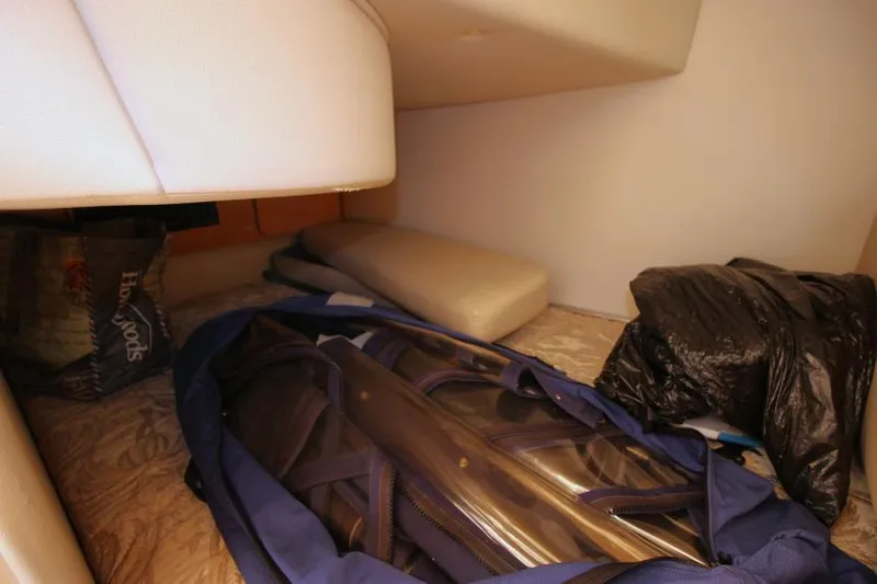 Slide: The Image of Storage area inside 2006 Chaparral 276 Signature Cruiser with bags and cushions. - 30