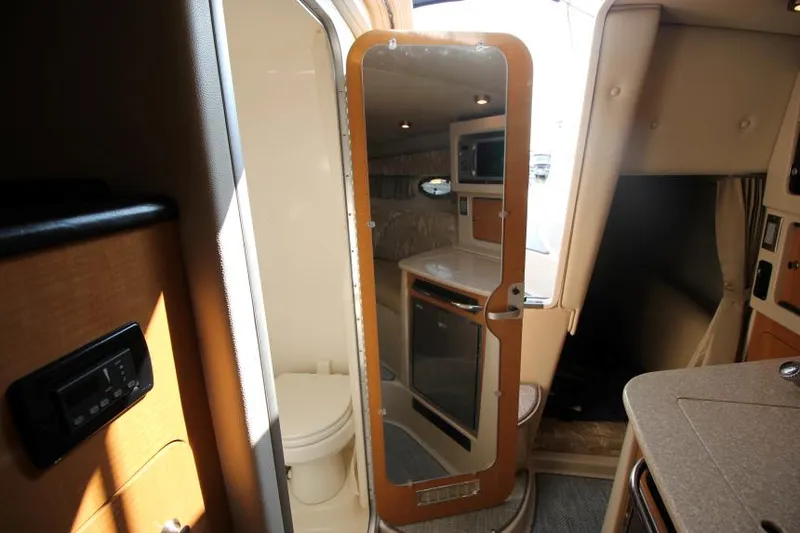 Slide: The Image of Interior of 2006 Chaparral 276 Signature Cruiser with kitchenette and mirror. - 33
