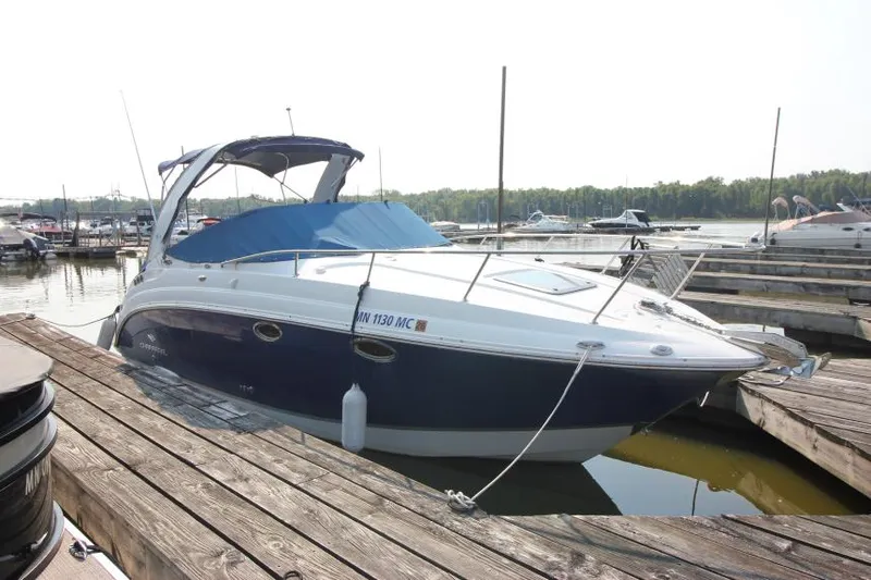 Slide: The Image of 2006 Chaparral 276 Signature Cruiser docked at marina. - 4