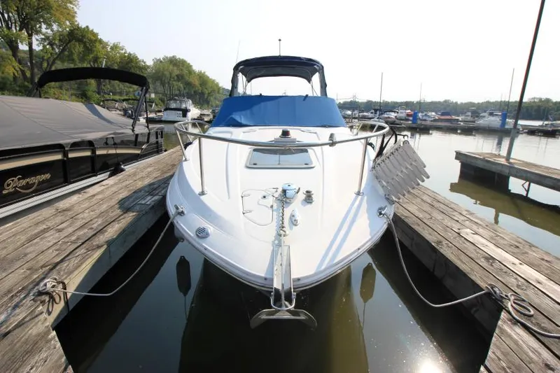 Slide: The Image of 2006 Chaparral 276 Signature Cruiser docked at marina, front view. - 5