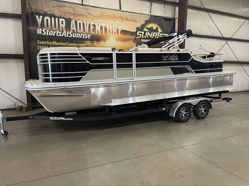 Slide: The Image of 2023 SunCatcher Elite 324SS pontoon boat on trailer in showroom. - 1