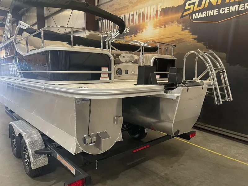 Slide: The Image of 2023 SunCatcher Elite 324SS pontoon boat on trailer in showroom. - 12