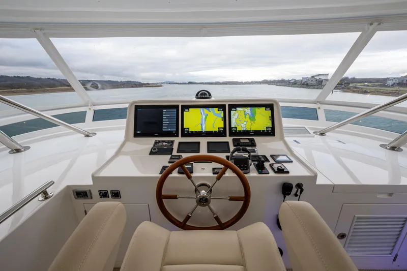 Slide: The Image of Helm station of 2025 Hampton Endurance 630 Euro yacht with navigation screens. - 18