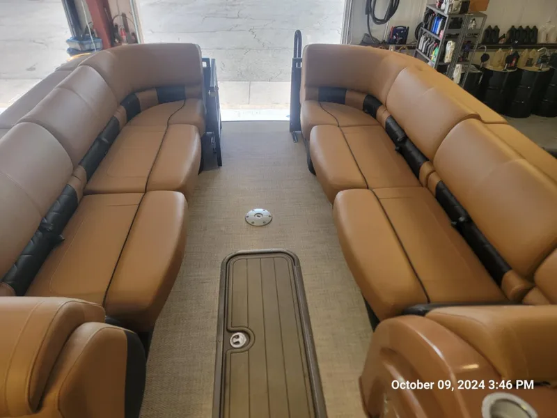 Slide: The Image of 2021 Regency 250 LE3 Sport boat interior with tan leather seating. - 2