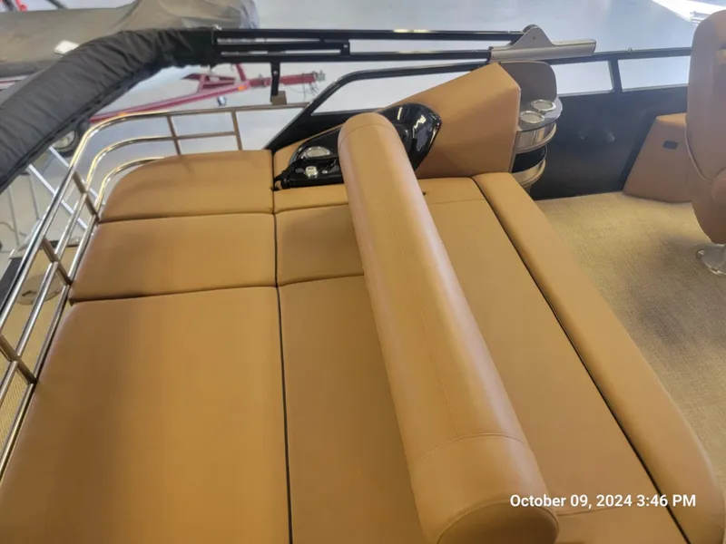 Slide: The Image of 2021 Regency 250 LE3 Sport boat interior with tan seating and sleek design. - 4