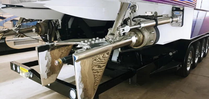 Slide: The Image of Close-up of the propulsion system of a 2020 Skater 50 boat on a trailer. - 12