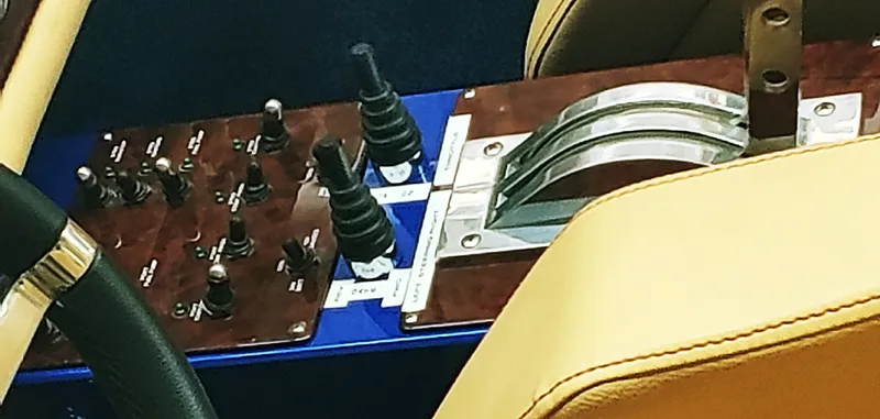 Slide: The Image of Close-up of Skater 50 boat control panel with switches and levers, 2020 model. - 18