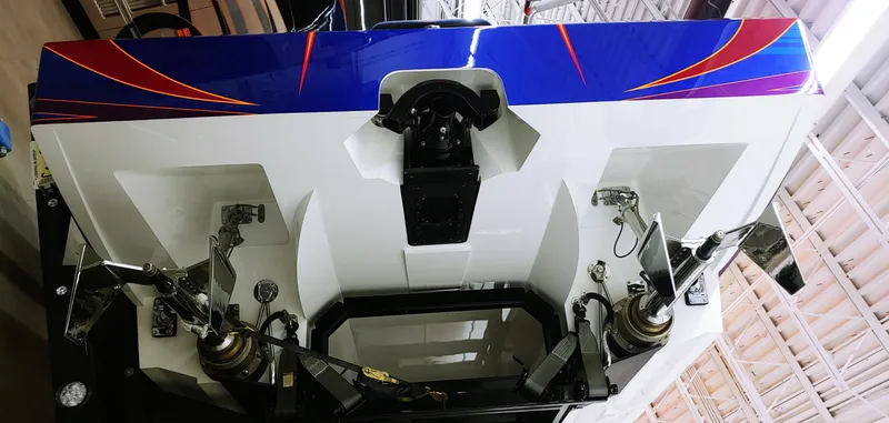 Slide: The Image of Close-up of the stern of a 2020 Skater 50 boat with vibrant graphics. - 22