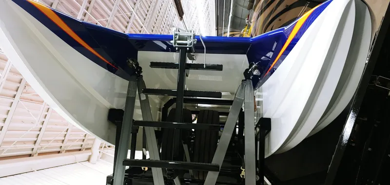 Slide: The Image of Skater 50 boat model 2020 in a storage facility, showing the hull and support structure. - 24