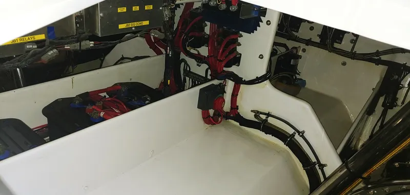 Slide: The Image of Engine compartment of a 2020 Skater 50 boat with wiring and components. - 26