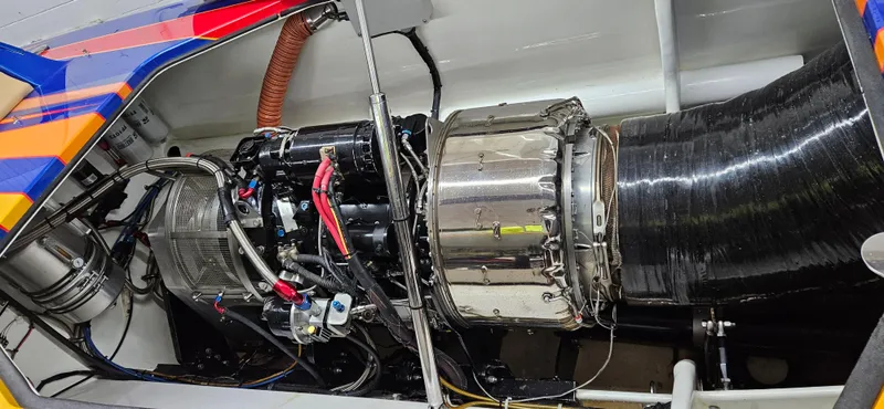 Slide: The Image of Close-up of Skater 50 boat engine, 2020 model, showcasing intricate mechanical components. - 8