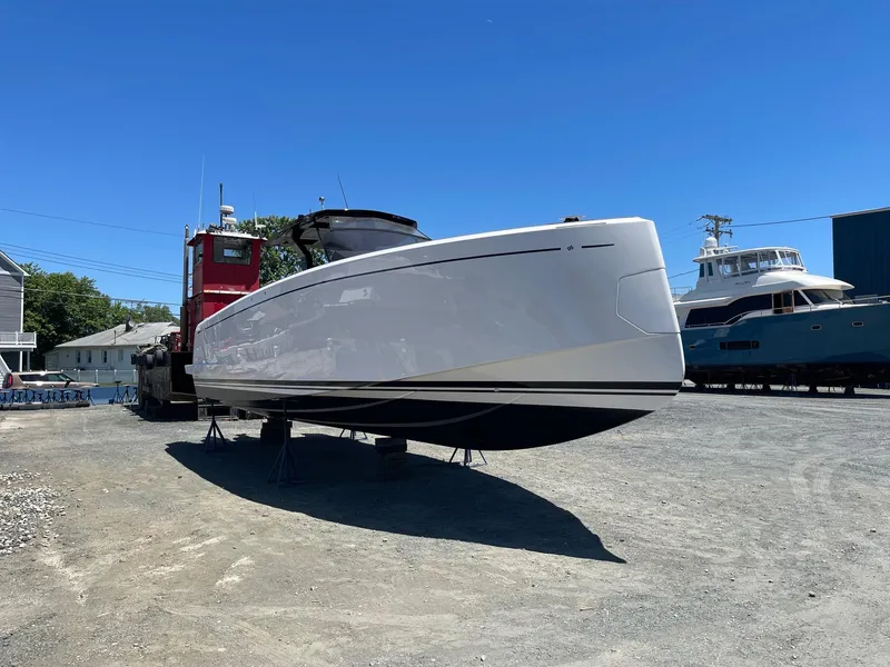 Slide: The Image of 2023 Pardo Yachts 38 on dry dock under clear blue sky. - 10