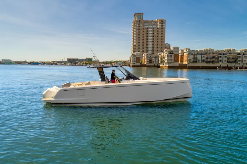 Slide: The Image of 2023 Pardo Yachts 38 cruising in a scenic urban waterfront. - 17