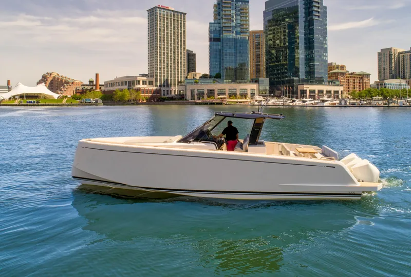 Slide: The Image of 2023 Pardo Yachts 38 cruising in urban waterfront with skyscrapers in background. - 21