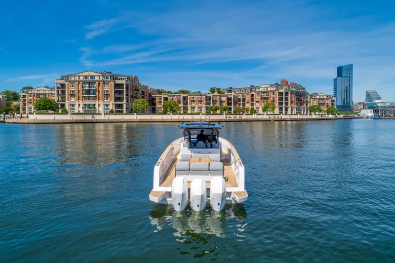 Slide: The Image of Pardo Yachts 38 (2023) cruising on a river with cityscape background. - 22