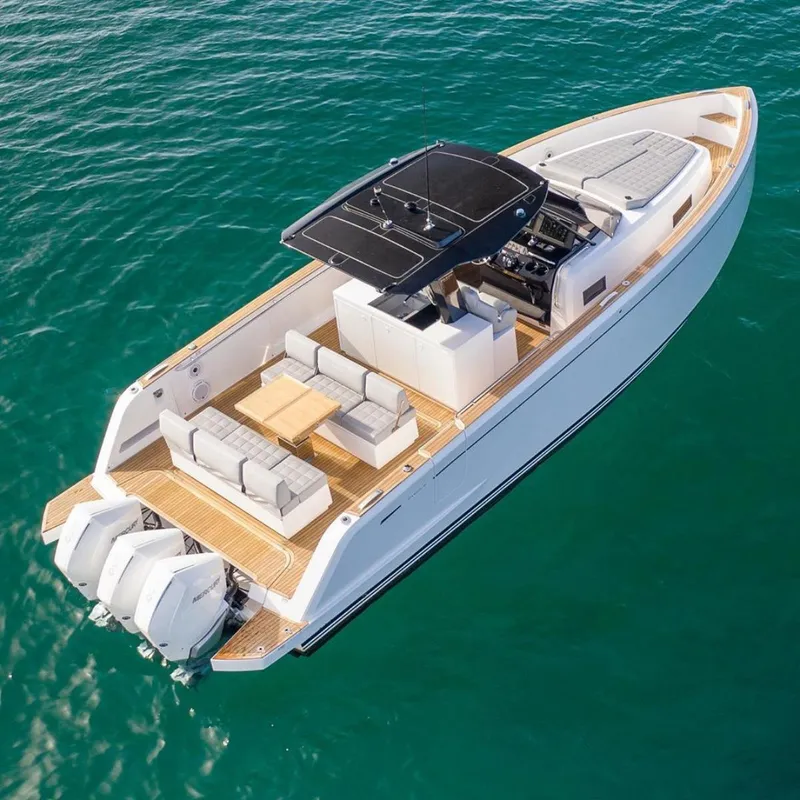 Slide: The Image of 2023 Pardo Yachts 38 model on clear blue water, showcasing luxury deck and seating. - 23