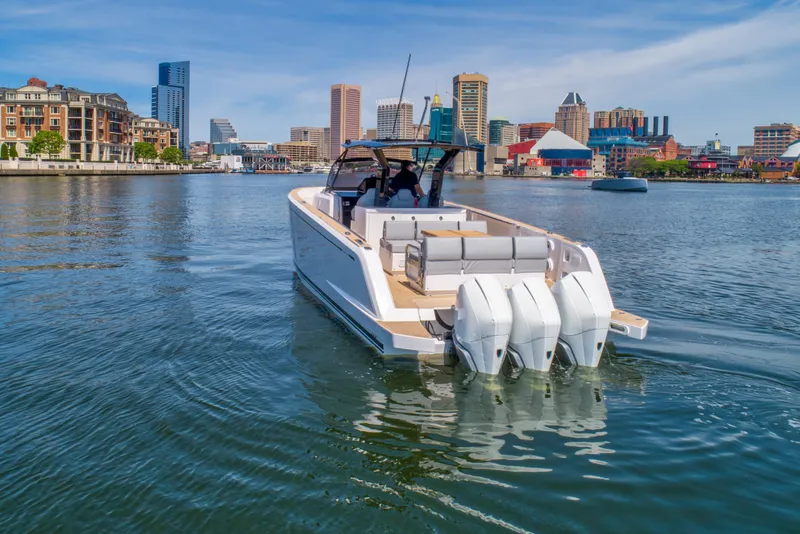 Slide: The Image of Pardo Yachts 38 (2023) cruising in urban waterfront with city skyline in background. - 4