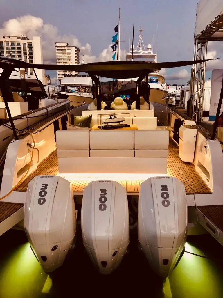 Slide: The Image of 2023 Pardo Yachts 38 with triple outboard engines docked at marina. - 46