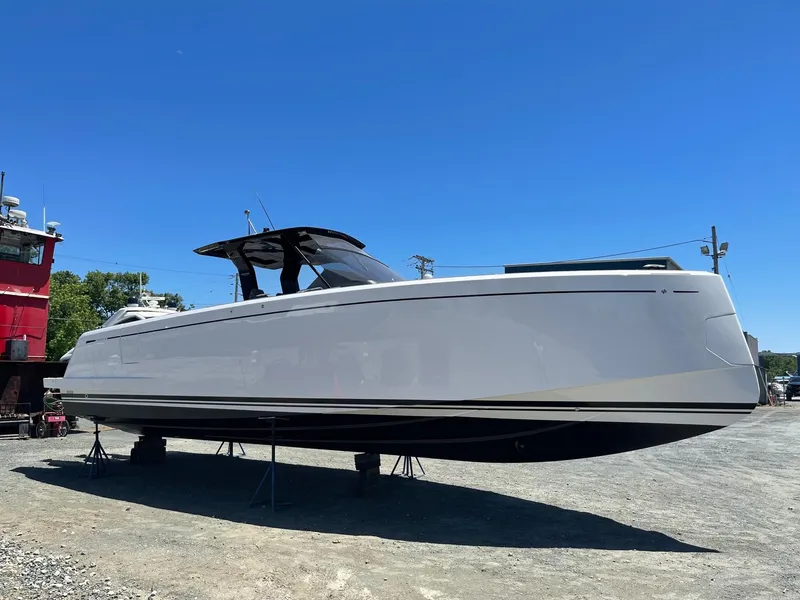 Slide: The Image of 2023 Pardo Yachts 38 on land, side view under clear blue sky. - 5