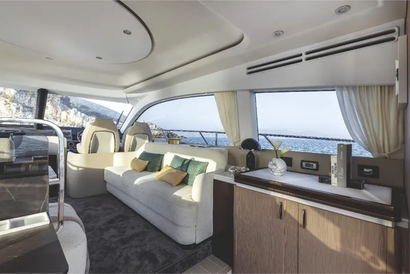 Slide: The Image of Luxurious interior of 2023 Azimut 53 yacht with scenic ocean view. - 17