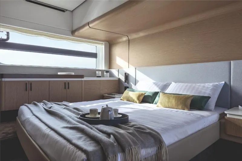 Slide: The Image of Luxurious bedroom interior of 2023 Azimut 53 yacht with modern design and natural light. - 19