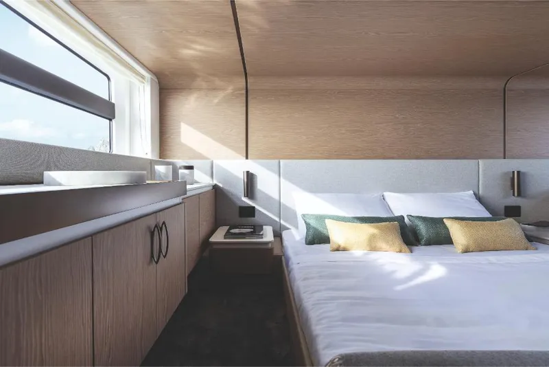 Slide: The Image of Luxurious bedroom interior of 2023 Azimut 53 yacht with modern design and large window. - 21