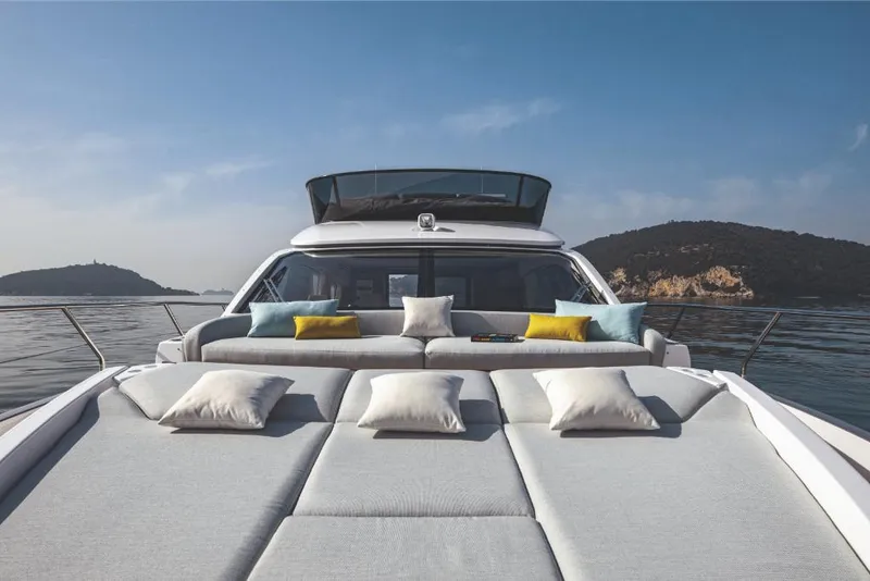 Slide: The Image of Luxury Azimut 53 yacht 2023 model with sunbeds and scenic ocean view. - 8