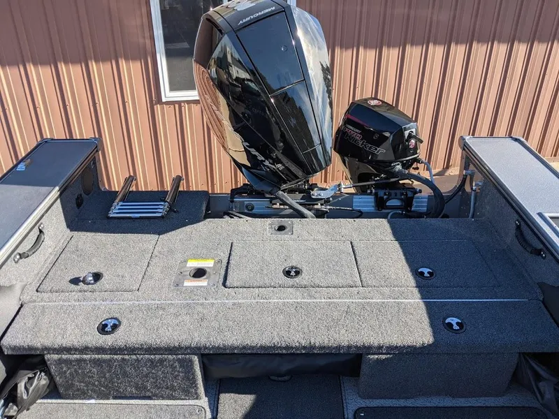 Slide: The Image of 2025 Lund 2075 Pro V Sport boat with outboard motor and storage compartments. - 5