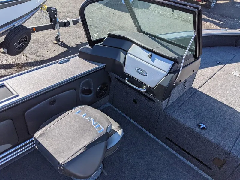 Slide: The Image of 2025 Lund 2075 Pro V Sport boat interior with seating and storage compartments. - 9