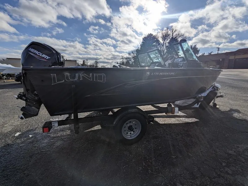 Slide: The Image of 2024 Lund 1775 Adventure Sport boat on trailer with Mercury outboard motor. - 10
