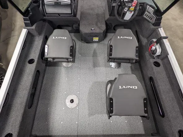 Slide: The Image of 2024 Lund 1775 Adventure Sport boat interior with three gray Lund seats. - 6