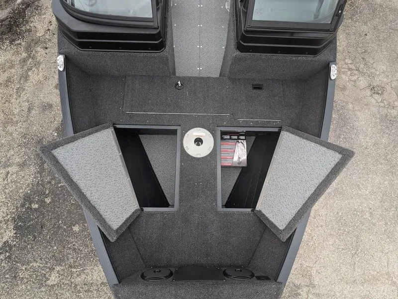 Slide: The Image of 2025 Lund 1650 Angler boat interior with open storage compartments. - 4
